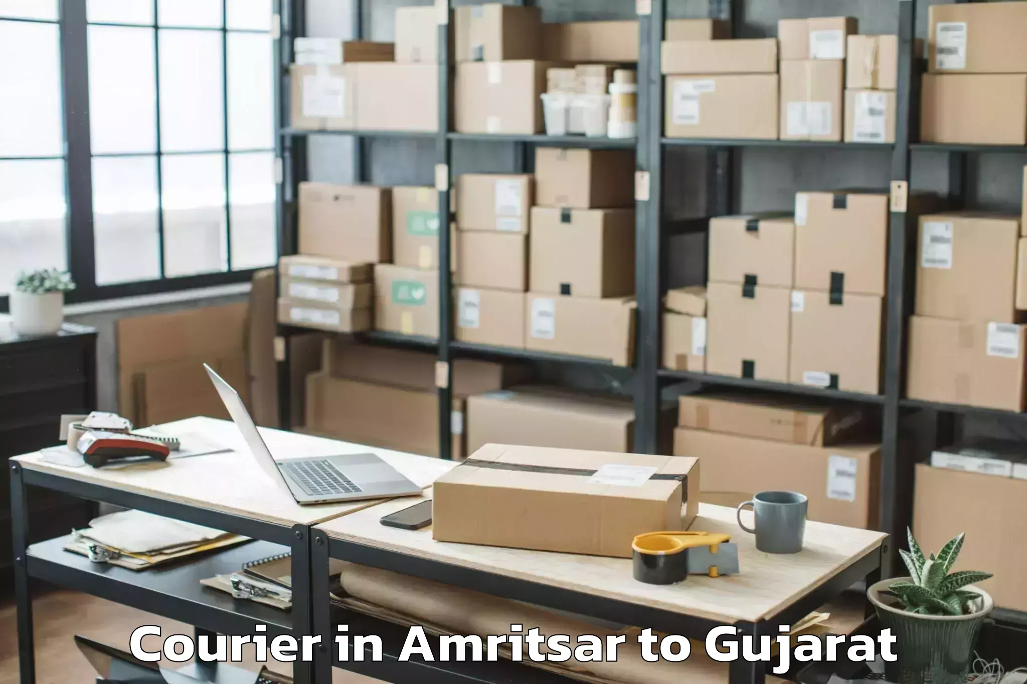 Reliable Amritsar to Hemchandracharya North Gujarat Courier